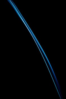 beautiful patterns created with the smoke of a bar of inciense and colorized over a black background