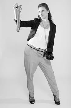 beautiful young photographer with a medium format fillm camera in black and white