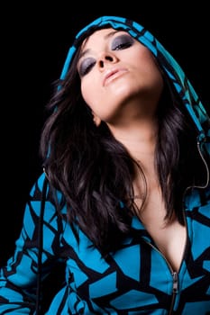 beautiful brunete girl in an aggressive attitude with a dark background