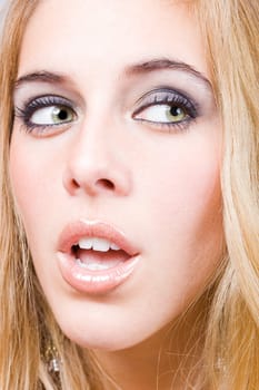 a portrait of a real beautiful young surprised girl