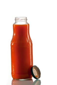 Tomato juice in a glass bottle