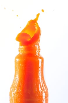 Carrot juice squirts out of the bottle