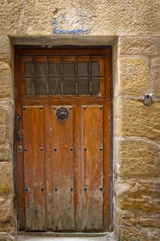 Architectural detail. Antique wooden door, Labastida, Alava, Spain