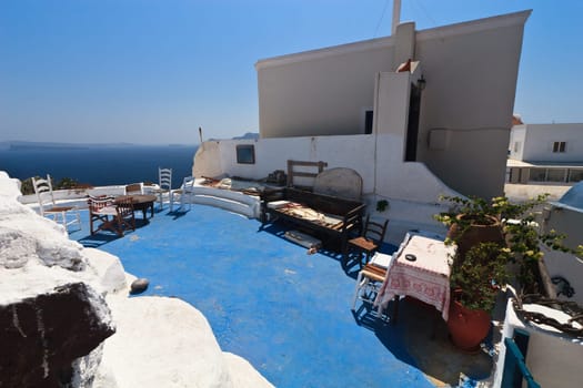a rustic outdoor room in Santorini, Greece