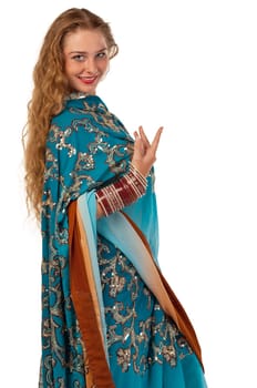 Young girl stand in blue traditional indian costume isolated