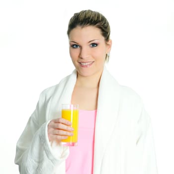 Beautiful blond woman relaxing at home whith an orange juice