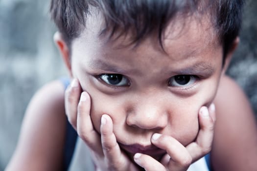Asian boy portrait - Filipino child contemplating closeup, shallow dof