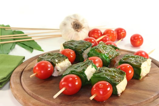 Sheep's cheese wrapped in wild garlic and cherry tomatoes