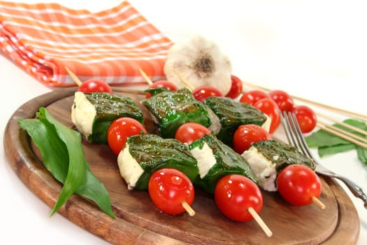 Sheep's cheese wrapped in wild garlic and cherry tomatoes