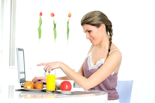 beautiful woman is having breakfaxt at home