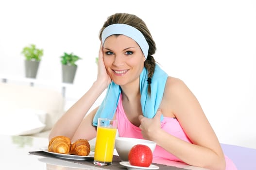 young athletic woman having breakfast