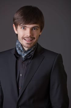 portrait of happy fashion man in business suit