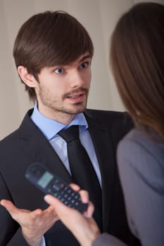 angry discussion in office between man and woman