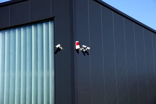 Security Camera And Alarm System At A Building Vertical