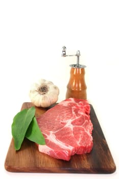 a pork neck chop against a white background