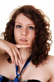 The beautiful smiling face of a young woman in closeup with her nice blue eyes.
