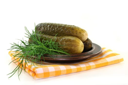 Pickles and dill on a plate