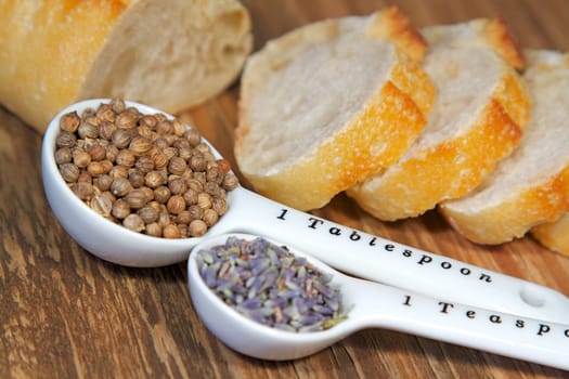 Old table-top selection of herbs and grains in measuring spoons