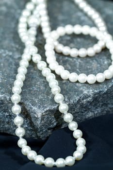 Vintage antique necklace closeup on a natural stone background