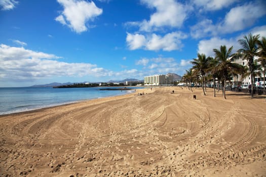 Fantastic image of a town beach with blue sky
