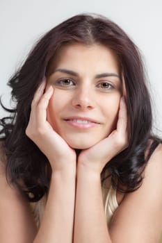 Portrait of pretty young woman lean her head on her hands