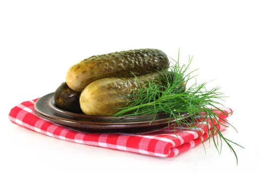 Pickles and dill on a plate