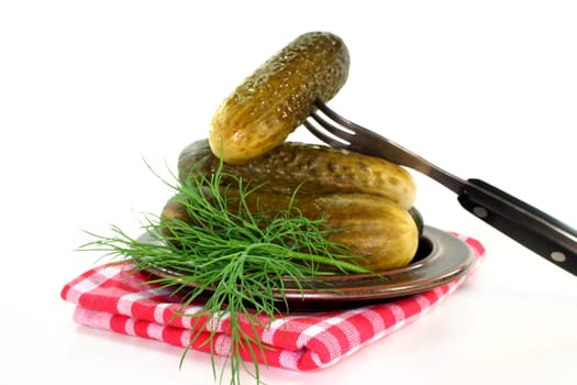 Pickles and dill on a plate