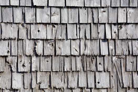 Old wooden shingle siding. Can be used as a background
