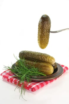 Pickles and dill on a plate