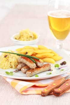 German traditional meal - White sausage with sour cabbage and rolled noodle with beer