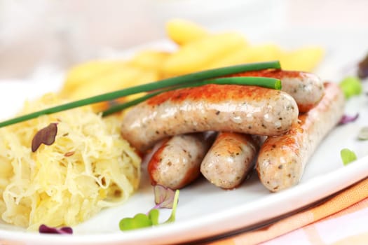 German traditional meal - White sausage with sour cabbage and rolled noodle with beer
