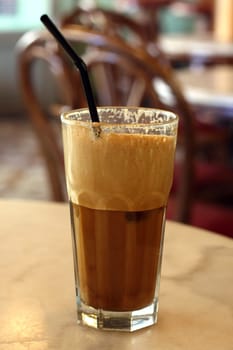 Greek coffee, cold Frape drink on a marble table