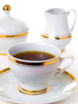 Tea and a teapot isolated on white background