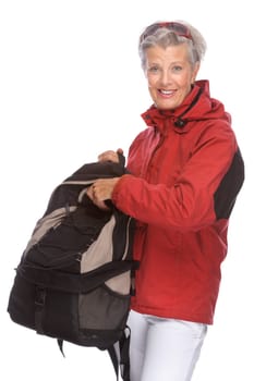 Studio shot of an active senior woman wearing hiking clothes