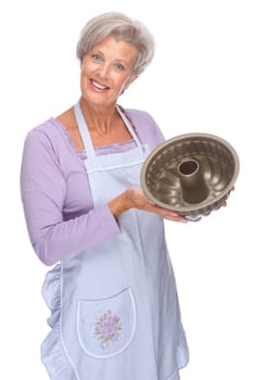 Studio shot of an active senior woman in the kitchen