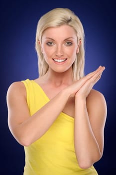 Studio shot of a young woman with a colored background