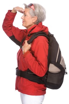 Studio shot of an active senior woman wearing hiking clothes