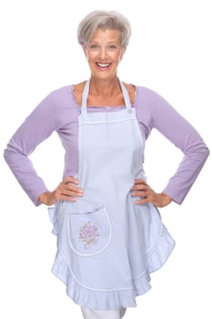 Studio shot of an active senior woman in the kitchen