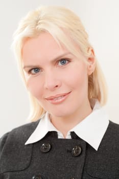 Portrait of a young and blonde businesswoman
