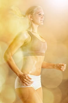 Young jogger in backlight