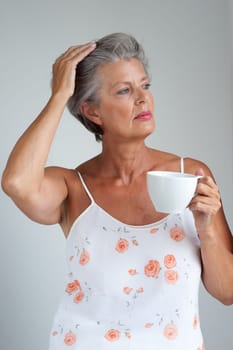 Active senior woman in the morning with a cup of coffee
