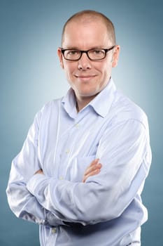 Studio shot of a man against blue background