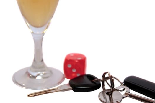 dice and champagne flute with car keys on white background depicting gambling with drunk driving and addictions can kill