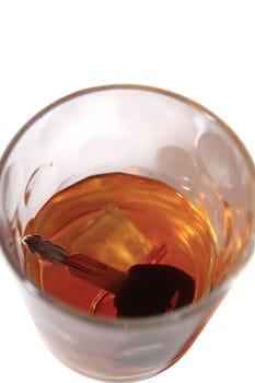 whiskey with keys inside glass on white background depicting drunk driving and addictions can kill