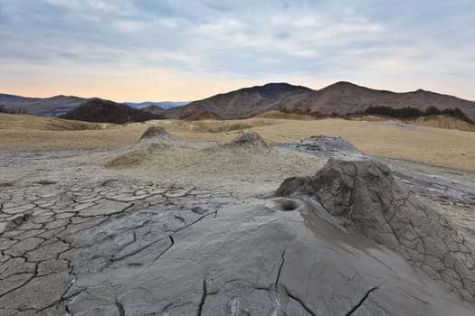Strange landscape (dry mud, scorched earth) produced bu active mud volcanoes. Location: Romania, Buzau county.