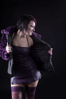 Young girl in purple fur coat - gothic style make up