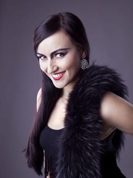 Beauty woman smile in fur boa - retro style make-up