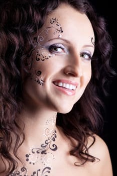 Beauty woman face with paint close-up portrait