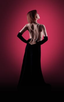 Woman glamour portrait in red dark - retro style