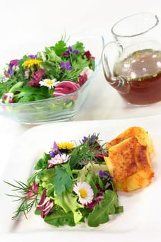 Wild herb salad with goat's cheese baked in a potato coat